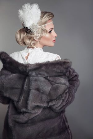 Elegant Fashion Retro Woman in Blue Mink Fur Coat. Beautiful Luxury Winter Clothes. Vintage style.