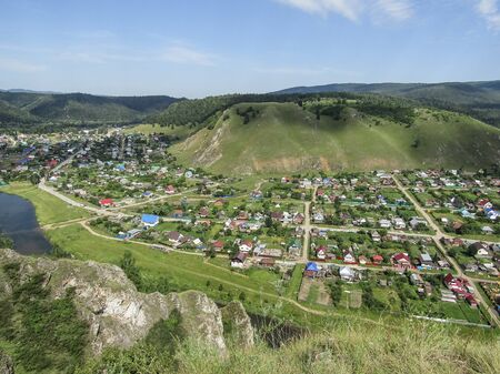 View from the mountain to the houses, to the village. Natural summer landscape. Beautiful landscape...