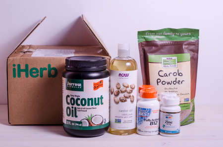 Chelyabinsk, Russia. 06.05.2020. The package of Iherb is coconut oil, castor oil, carob, B12 vitamins, zinc. Organic food and other products.のeditorial素材