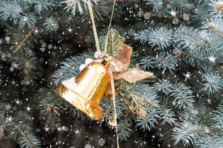 Decorative toy on a Christmas tree with selective focus. Festive background for New Year