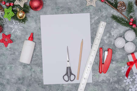 Christmas diy craft, making three-dimensional paper decor for decorating a room. Step-by-step photo instructions. Step 1 - preparation of materials - paper, glue, scissorsの写真素材