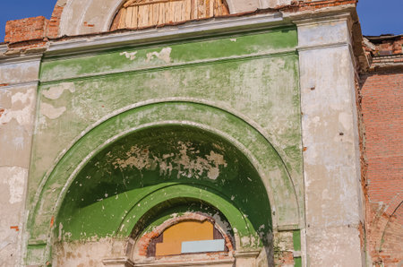 Dilapidated walls of an old abandoned temple building, destroyed by timeの写真素材