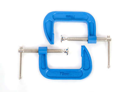 Clamp - professional tool for clamping objects isolated on a white background.の写真素材