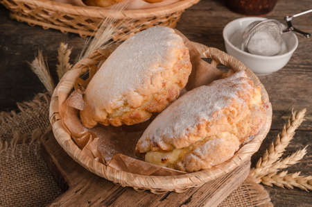 Delicious fresh culinary baked goods- sweet shortbreads with filling close-up on wooden background