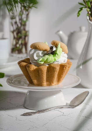 Pastry with a basket of shortcrust pastry and protein cream in the form of mushroomsの写真素材
