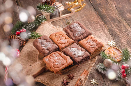 Christmas background, festive baking gingerbread cookies on wooden background