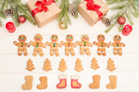 Christmas and New Year card with a composition of gifts, Christmas tree decorations and branches,...