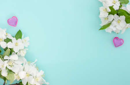 Valentine's day blue background with hearts and flowers with copy space, spa treatment theme for...