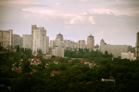 modern city spring, before the rain, against the sky and the parkの写真素材