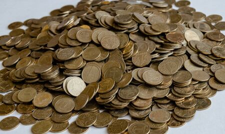 metal coins, one hryvnia nominee, slide closeup on a white background