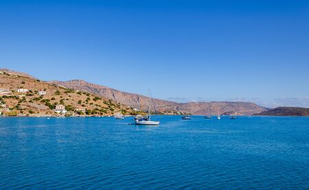 beautiful landscape on a warm sunny day by the sea, with clear transparent water and blue sky, Creteの写真素材