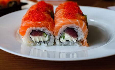rolls and sushi on a light background, tasty food at home, closeupの写真素材