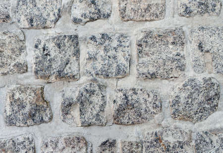 masonry background, fences with stone gravel close upの写真素材
