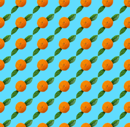 orange tangerine on blue background, seamless pattern with fruitsの写真素材