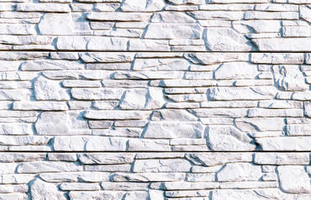 decorative stone wall, texture with light slate stone surface.