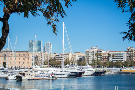 BARCELONA, SPAIN - FEBRUARY 12, 2014: A view to a pier with yachts at Barcelona port, Catalonia, Spain.のeditorial素材