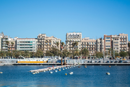 BARCELONA, SPAIN - FEBRUARY 12, 2014: A view to a pier with yachts at Barcelona port, Catalonia, Spain.のeditorial素材