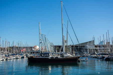 BARCELONA, SPAIN - FEBRUARY 12, 2014: A view to a pier with yachts at Barcelona port, Catalonia, Spain.のeditorial素材