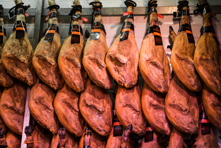 MADRID, SPAIN - FEBRUARY 12, 2017: Ham legs at San Miguel Market at Madrid, Spain.のeditorial素材