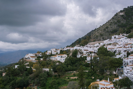 A paroramic view of a mountain and Mijas, a small touristyc white-washed village at Malaga province...