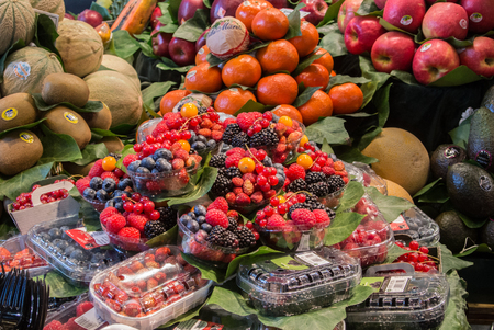 BARCELONA, SPAIN - FEBRUARY 12, 2014: Fruits and berries at La Boqueria food market at the center of Barcelona, Spain.のeditorial素材