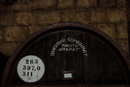 YEREVAN, ARMENIA - DECEMBER 30, 2016: Wooden barrel of aged wine at cellar of Brandy Factory Noy of...