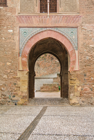 GRANADA, SPAIN - FEBRUARY 10, 2015: An archway to patio with fountains at Alhambra palace, Granada, Andalusia, Spain.のeditorial素材