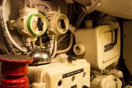 KALININGRAD, RUSSIA - JUNE 12 2017: Close-up view of valves, tubes and other metal details of a machinery engineering interior space of a submarine B-413 (NATOâs Foxtrot), a museum vessel.のeditorial素材