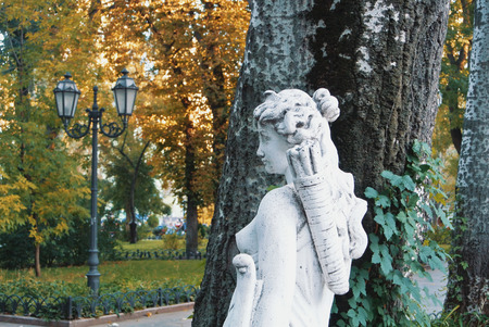 ODESSA, UKRAINE - OCTOBER 12, 2017: A white girl sculpture in the central park, city garden.のeditorial素材