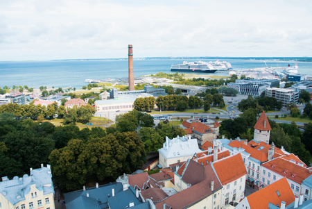 TALLINN, ESTONIA - JULY 22, 2015: Aerial panoramic view of Tallinn old town city center and port with big cruise ships on cloudy day, Estonia.のeditorial素材