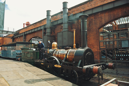 MANCHESTER, ENGLAND - AUGUST 11, 2013: Old vintage retro steam freight train standing outside at  Museum of Science and Industry of Manchester.のeditorial素材