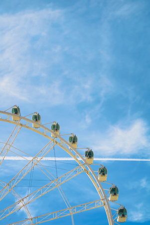 White beautiful modern ferris wheel with blue sky at the background. Copy space for text.のeditorial素材