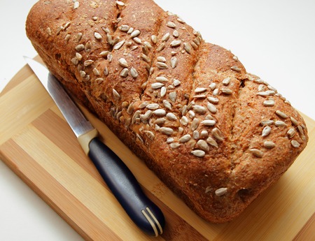 Bran bread, sprinkled with seeds and cooked at homeの写真素材