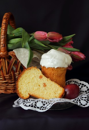 Tulips in the basket, Easter cake and eggs
