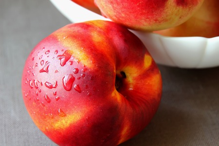 Ripe nectarine lying on the table
の写真素材