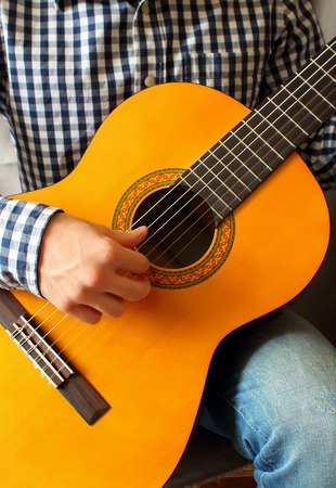 The game is a young man on the guitar
