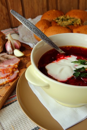 A plate of hot borscht with sour creamの写真素材