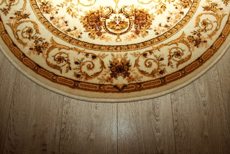 Wool oval rug on the floorの写真素材