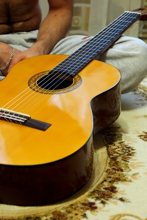 Guitar, lying on the floorの写真素材