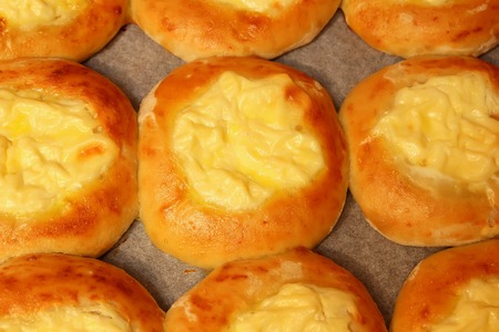 Baked cheesecake with cream cheese on a baking sheetの写真素材