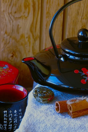 Teapot and cup with green teaの写真素材