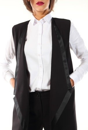 Modern black pantsuit with a white blouse on a model.の写真素材