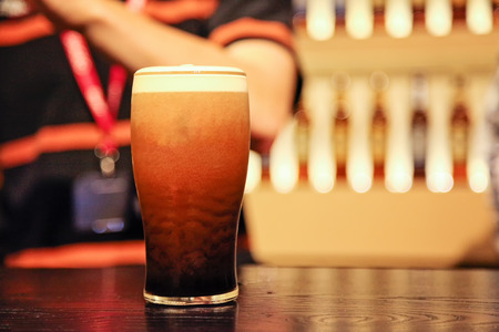 Pint of beer at the counterの写真素材