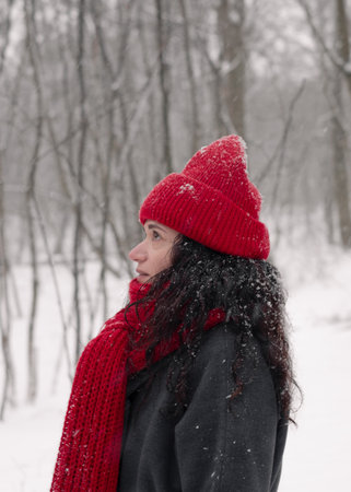Snowy day joy: red hat, scarf, and gloves