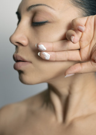 Woman caring for her facial skinの写真素材
