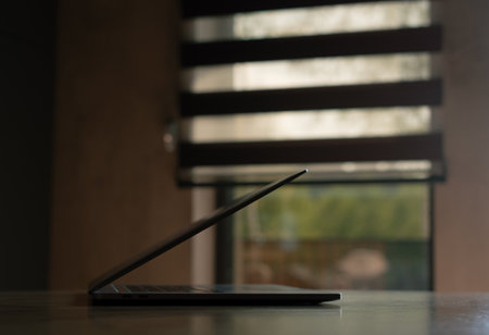 Laptop on table in roomの写真素材