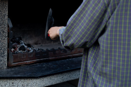 Lighting charcoal in covered grill.の写真素材