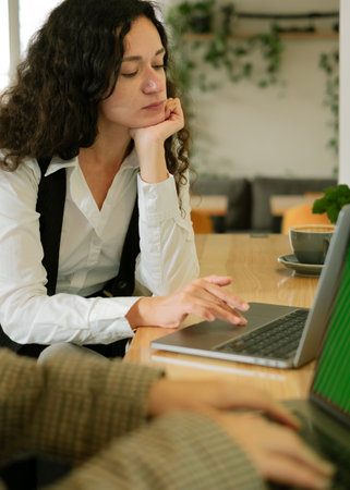 woman working on laptop with joy