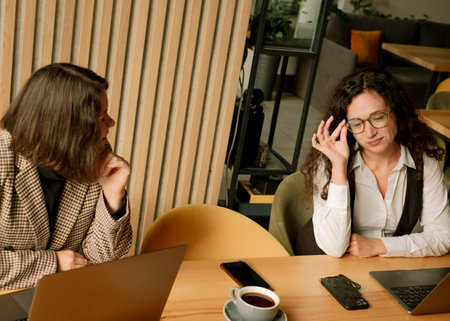 Social interaction among women working in a cafÃ©.