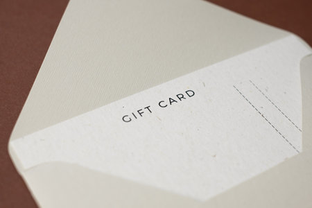Gift card in envelope on brown
